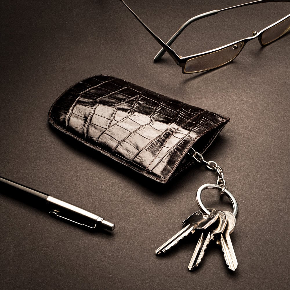 Leather key case with squeeze spring opening, brown croc, lifestyle