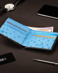 RFID wallet in ostrich leather, black with blue, lifestyle