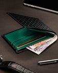 Woven leather wallet with 6 credit card slots, black with green, lifestyle