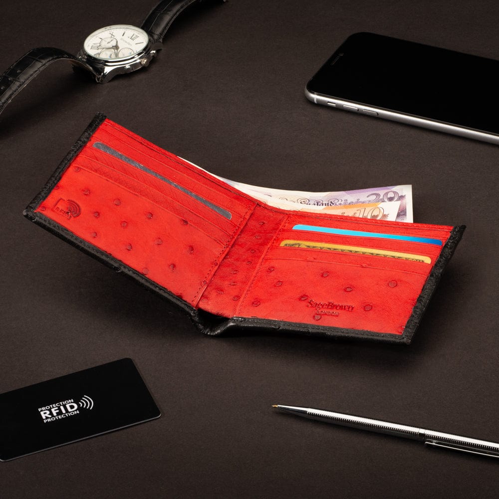 RFID wallet in ostrich leather, black with red, lifestyle