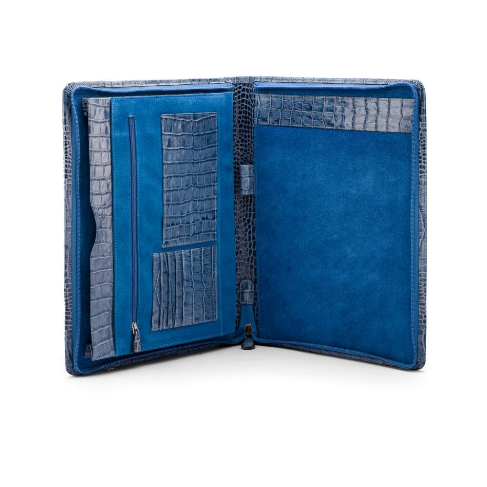 A leather notepad folder, blue croc, open
