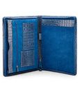 A leather notepad folder, blue croc, open