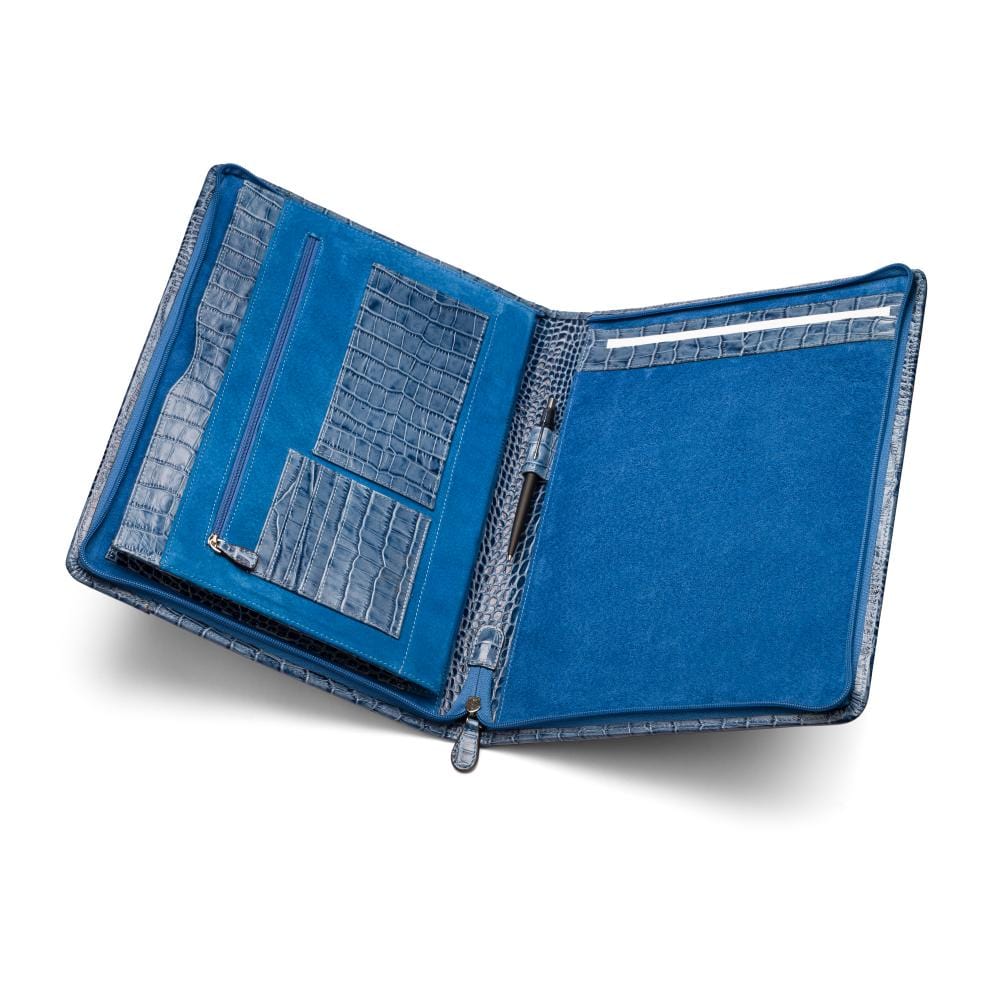 A leather notepad folder, blue croc, inside