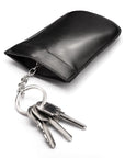 Leather key case with squeeze spring opening, black, open