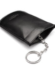 Leather key case with squeeze spring opening, black, back