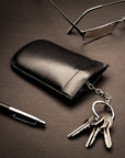Leather key case with squeeze spring opening, black, lifestyle