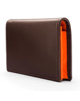 Expandable leather business card holder, brown with orange, side