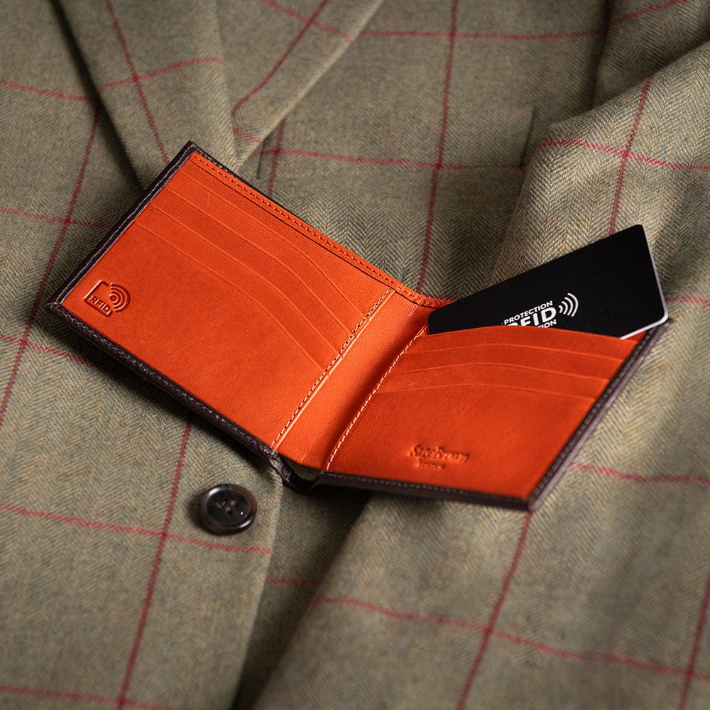 RFID leather wallet for men, brown with orange, lifestyle