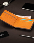 RFID wallet in ostrich leather, brown with orange, lifestyle