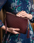 Leather woven cross body bag, burgundy, lifestyle