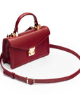 Maya top handle bag, burgundy, side