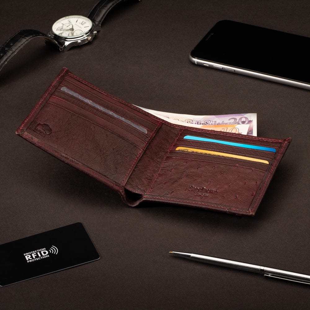 RFID wallet in ostrich leather, burgundy, lifestyle