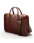 The Tressé leather laptop bag, burgundy woven, with strap