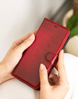 iPhone 15 Pro Max case in leather with RFID, burnished red, lifestyle