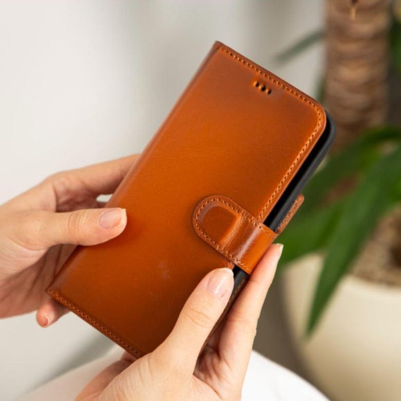 iPhone 14 Pro Max case with RFID, burnished tan, lifestyle