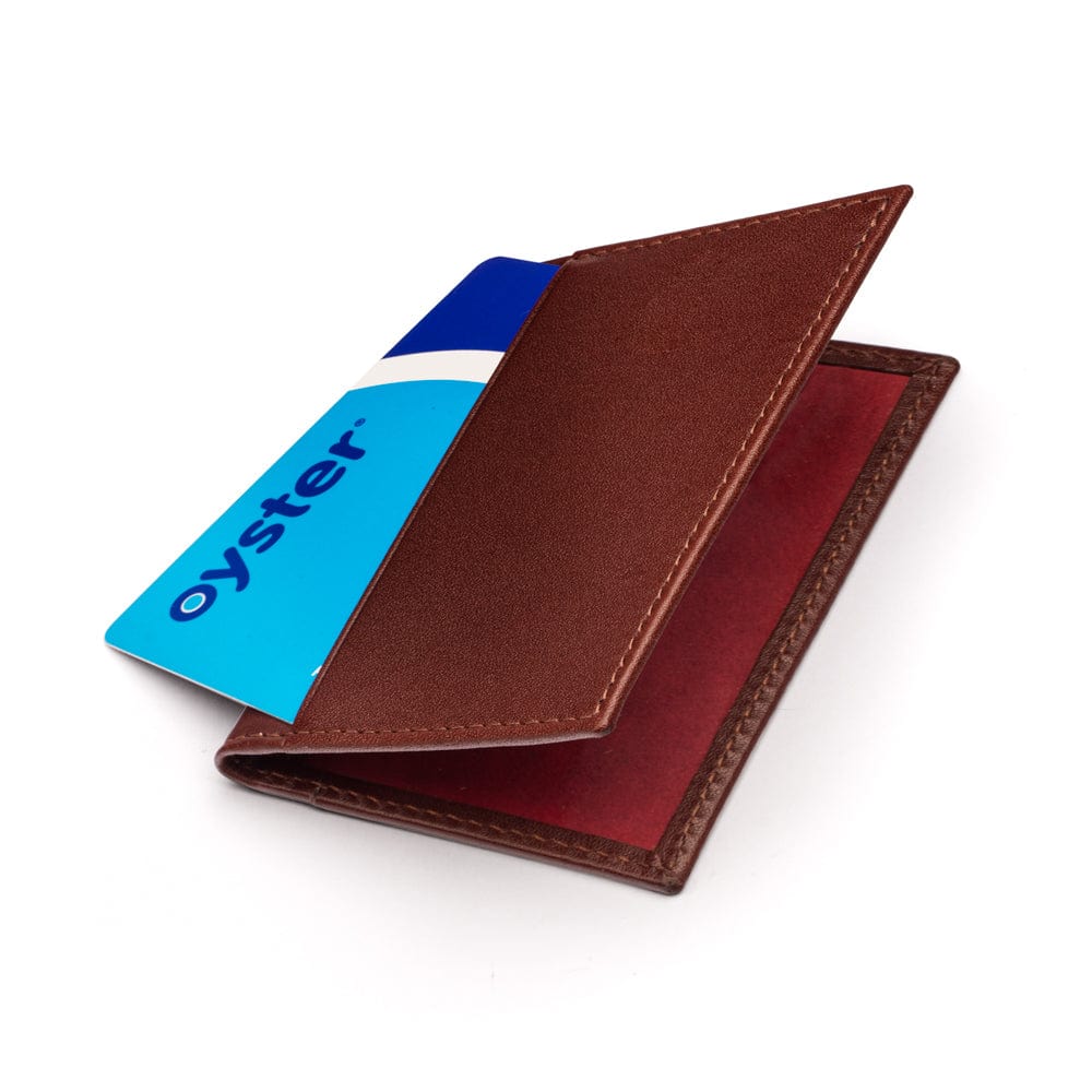 Leather travel card wallet, dark tan with red, front