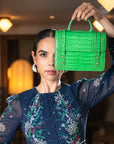 Mini top handle Harmony music bag, emerald croc, lifestyle view