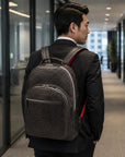 Men's leather 15" laptop backpack, grey croc-effect, on a models back
