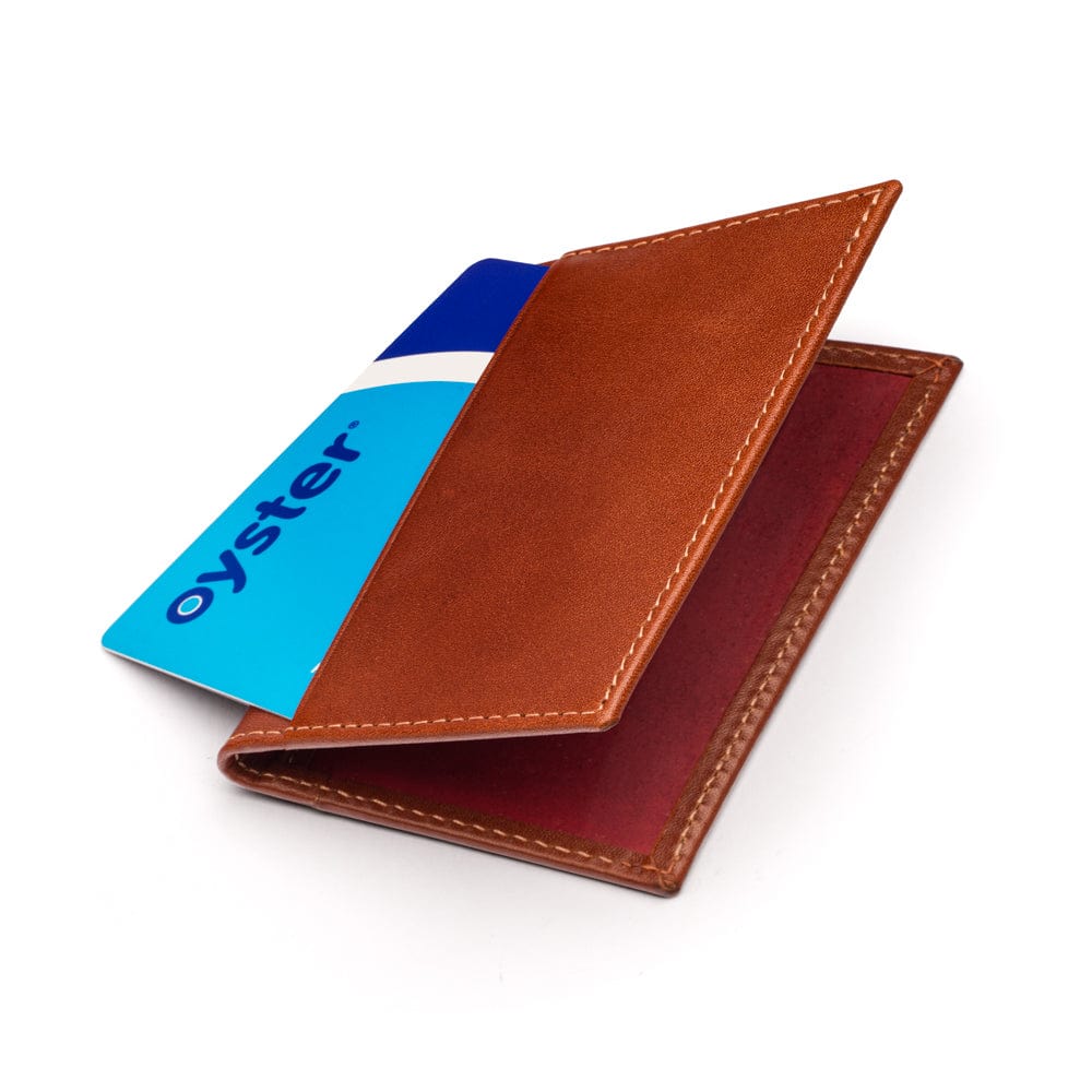 Leather travel card wallet, havana tan with red, front