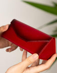 Triangular leather glasses case, burnished red, lifestyle