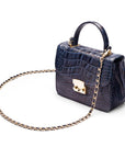 Small leather top handle bag, navy croc, side