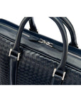 The Tressé leather laptop bag, navy woven, closeup