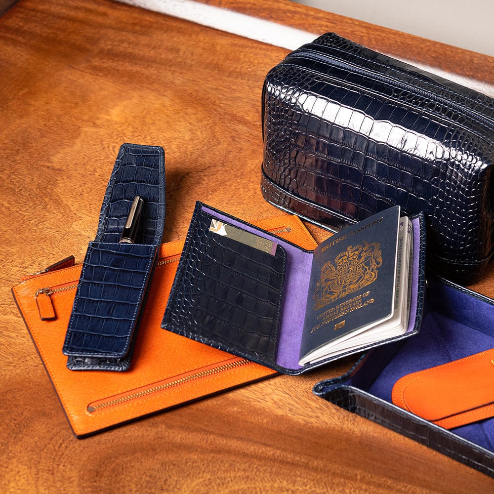 Leather travel document and currency case, orange, lifestyle