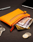 RFID Small leather zip coin pouch, orange pebble grain, lifestyle