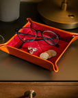 Leather valet tray, orange with red, lifestyle