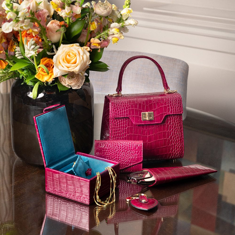 Compact leather jewellery box, pink croc, lifestyle
