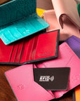 RFID bifold credit card holder, pink saffiano, lifestyle