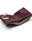 Leather purse with equestrain clasp, purple croc, inside