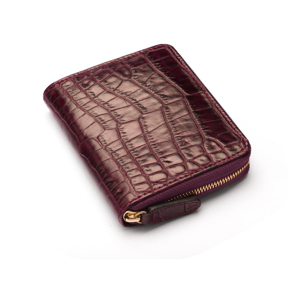Small leather zip around accordion coin purse, dark purple croc, front