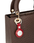Leather air tag holder, red, on a bag