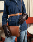 Leather cross body bag with chain strap, tan and brown gloves