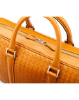 The Tressé leather laptop bag, tan woven, closeup