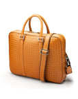 The Tressé leather laptop bag, tan woven, with shoulder strap