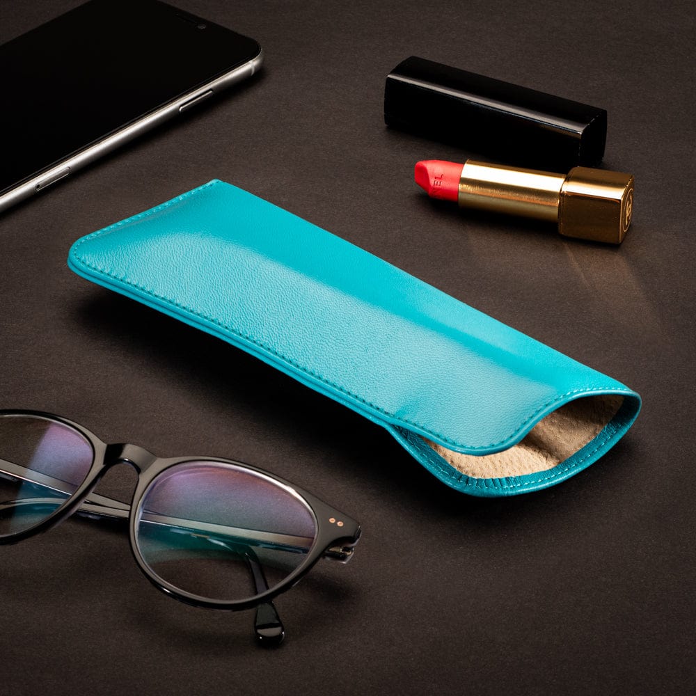 Large leather glasses case. soft turquoise, lifestyle