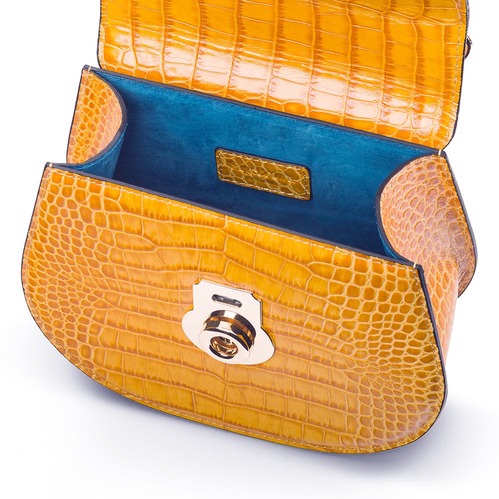 Leather rounded bottom top handle bag, yellow croc, inside