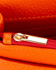 Small leather chain bag, orange, close up