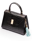 Decorative leather tassel, baby blue, on a bag