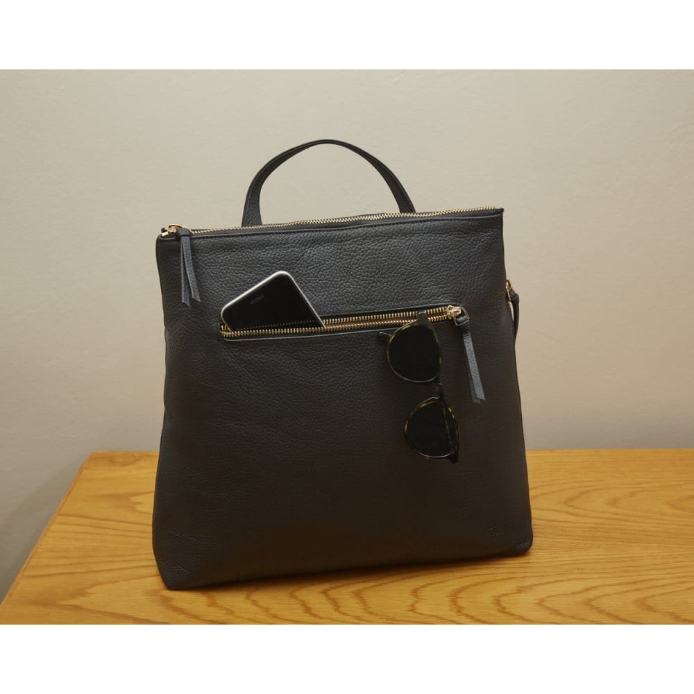 Leather 13" laptop backpack, black pebble grain, lifestyle
