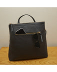 Leather 13" laptop backpack, black pebble grain, lifestyle