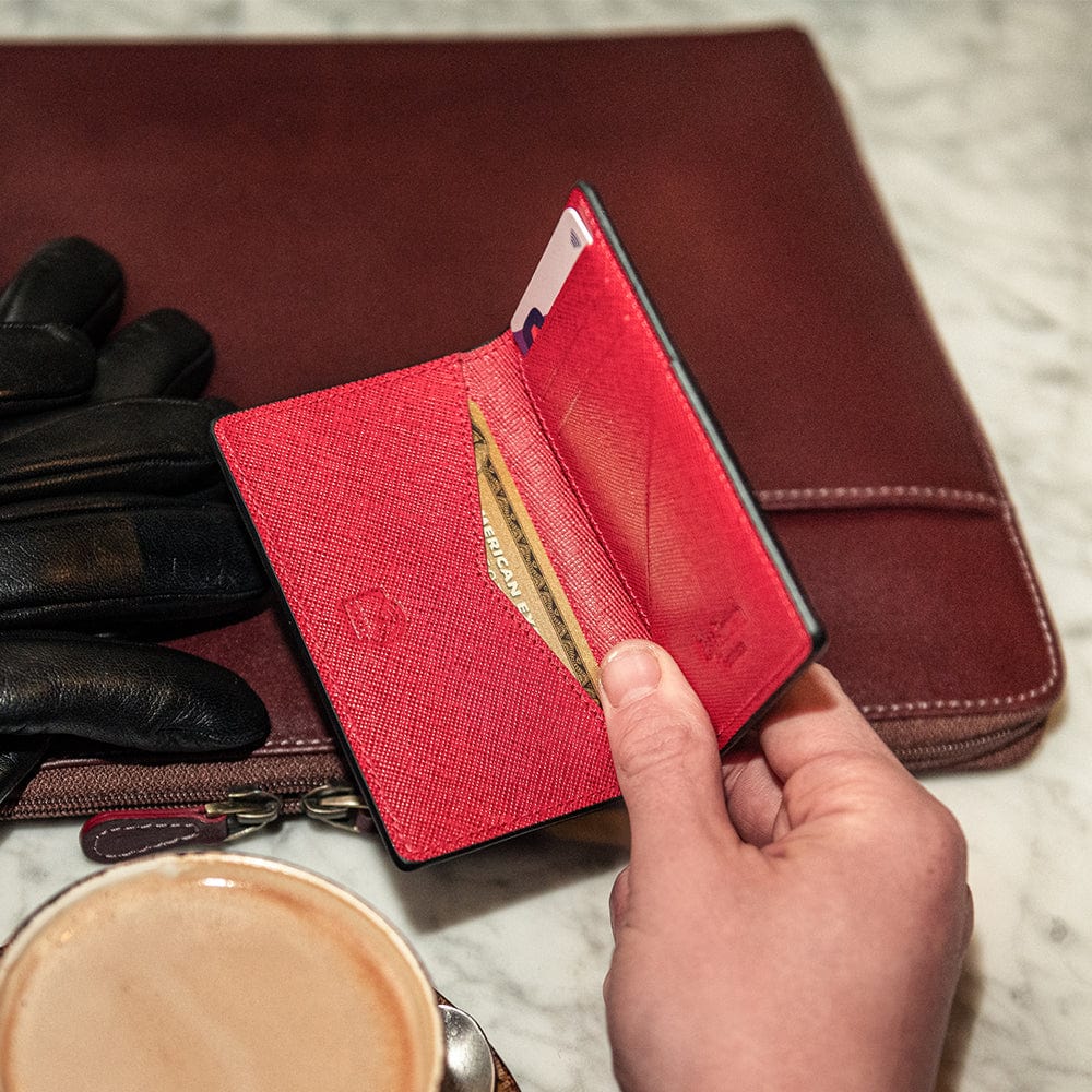 RFID bifold credit card holder, black with red saffiano, lifestyle