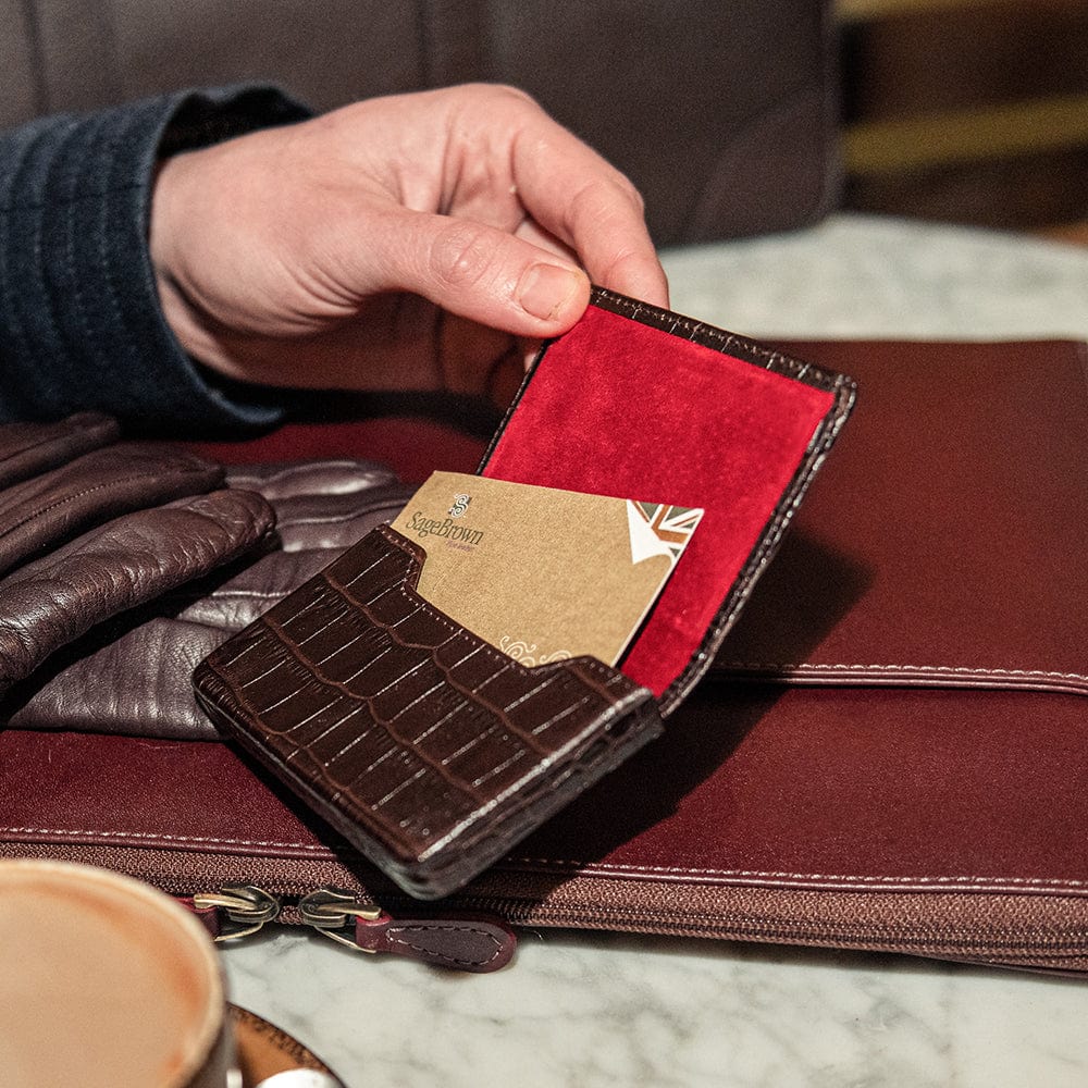 Leather business card holder with magnetic closure, brown croc, lifestyle