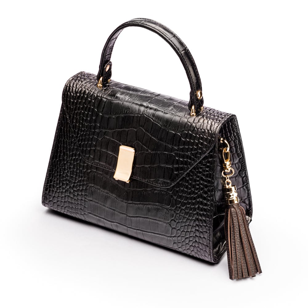 Decorative leather tassel, brown, on a bag