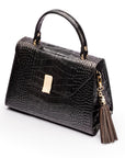Decorative leather tassel, brown, on a bag