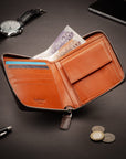 Men's leather zip wallet with coin purse, brown with orange, lifestyle