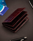 Leather bifold card wallet, burgundy croc, lifestyle