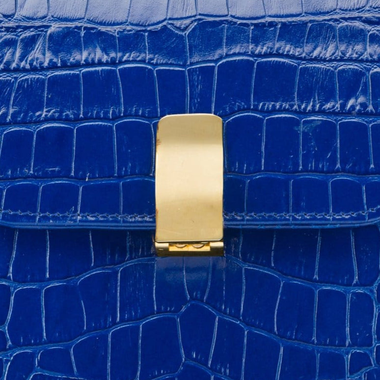 Leather top handle bag, cobalt croc, lock closeup